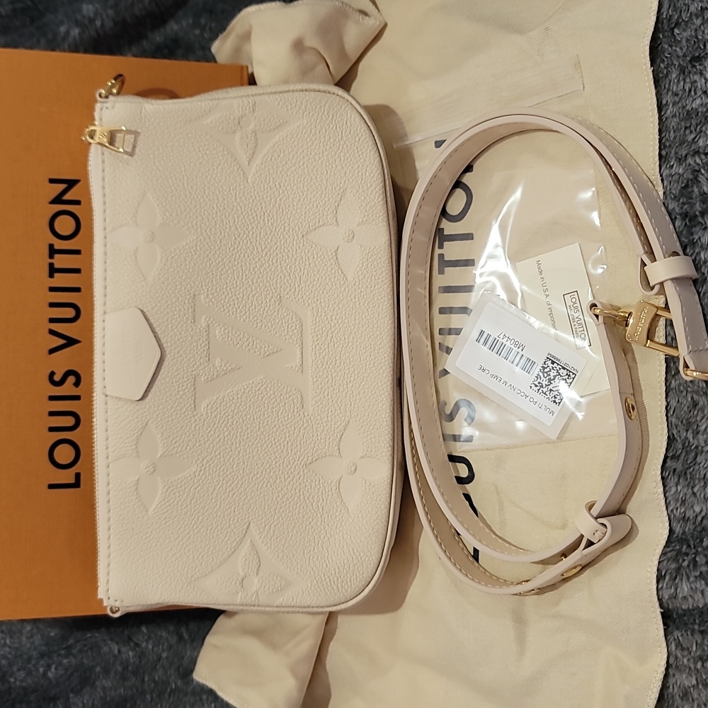 Louis Vuitton Empreinte Large Pochette Ivory Creme Leather 10x5.5x1.8in Strap